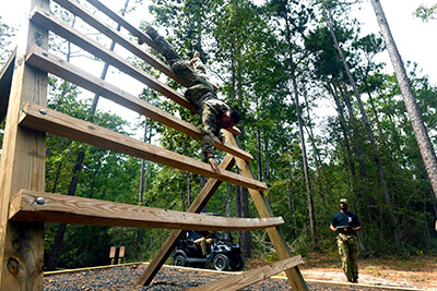 Cpl. Daniel D'Ippolito makes his way down the reverse climb portion of an obstacle course. D'Ippolito faced running, climbing, jumping, balancing and crawling elements with the aim of testing speed, endurance and agility. An infantryman with the Arizona Army National Guard’s Alpha Company, 1st Battalion, 158th Infantry Regiment, D'Ippolito would earn Soldier of the Year honors.